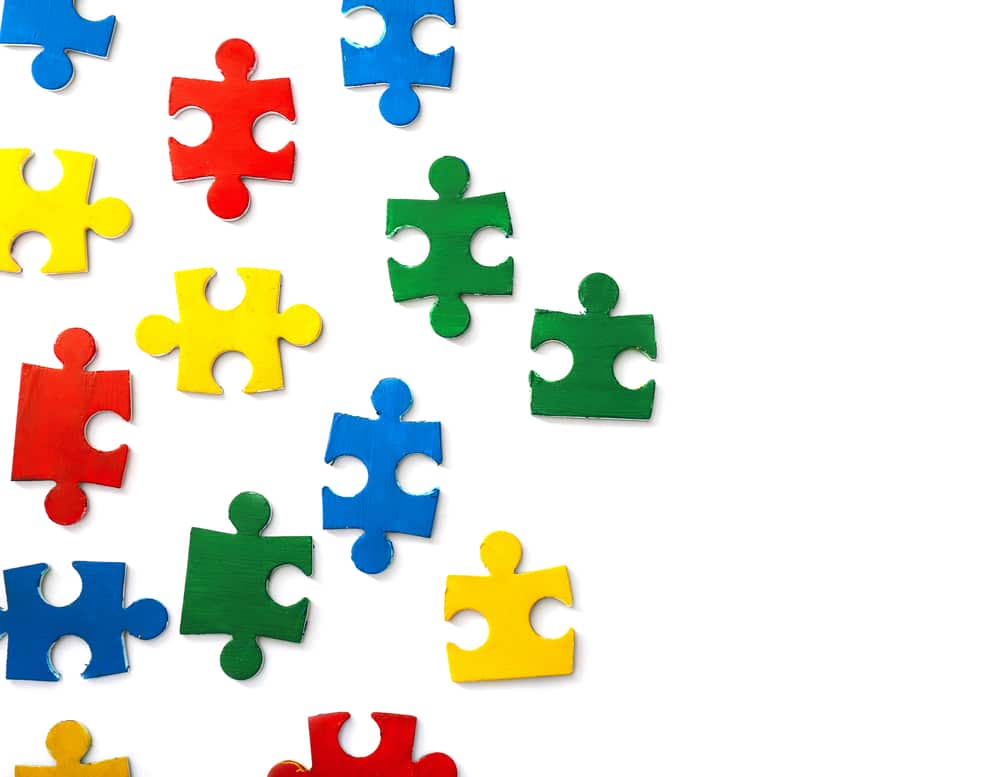 Pieces,Of,Colorful,Puzzle,On,White,Background.,Autism,Awareness,Concept