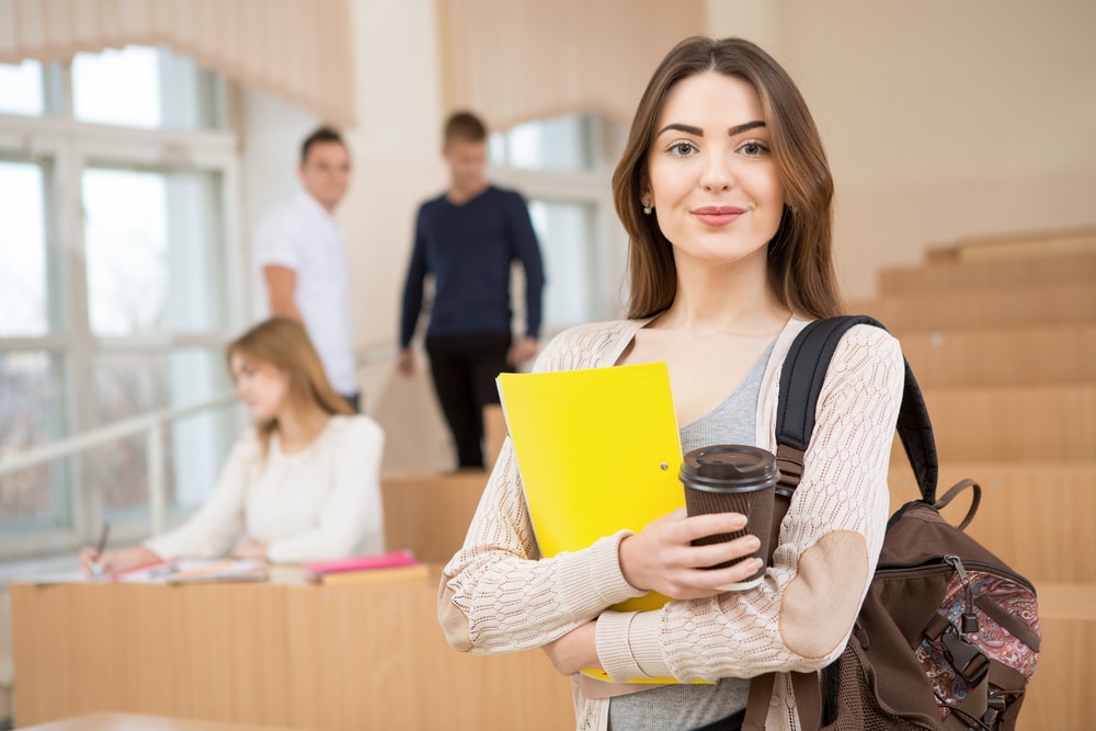 Education,First.,Beautiful,Female,College,Student,Holding,Her,Books,Smiling
